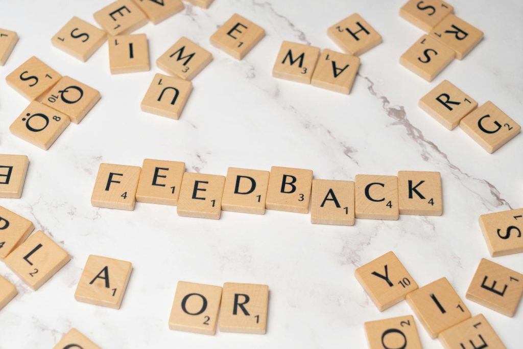 A puzzle, spelling the words "feedback"