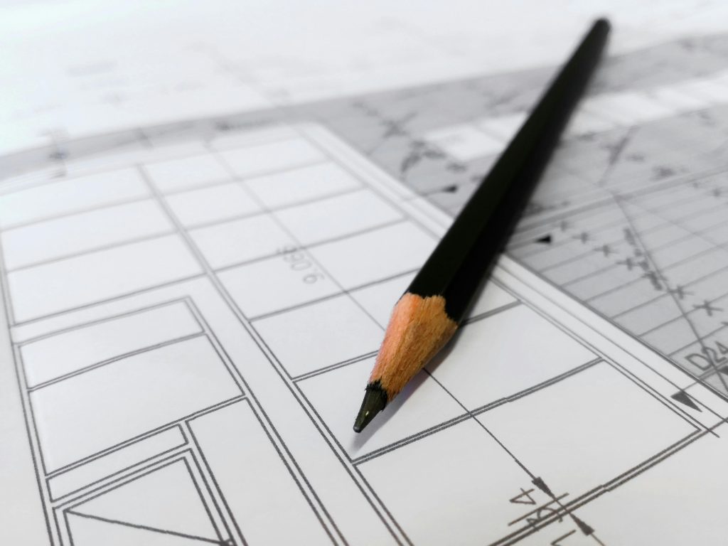 A pencil and diagram illustrating the correlation between drawing and accurate measurements.